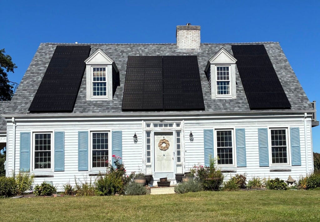 A photo showing rooftop solar panels on the Dartmouth, Mass. home of ESHLP borrower Pam.